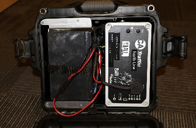 Black Cat device located inside of the case