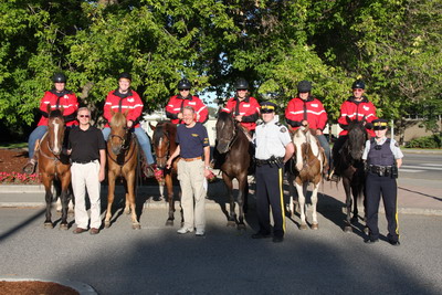 image of the Mounted Citizens on Patrol team  horse and riders with the RCMP members and community leaders