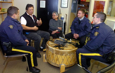 Image of members of the Downtown Safety Unit speaking with local First Nations elders