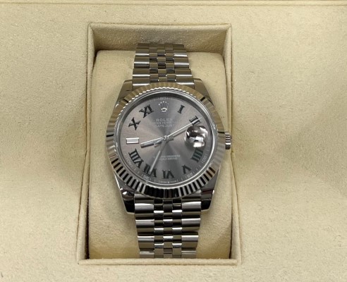 A close up image of a counterfeit Rolex