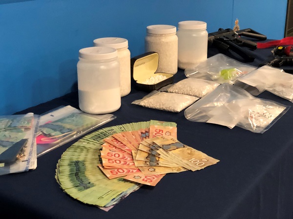 Photo of drugs and money seized by police