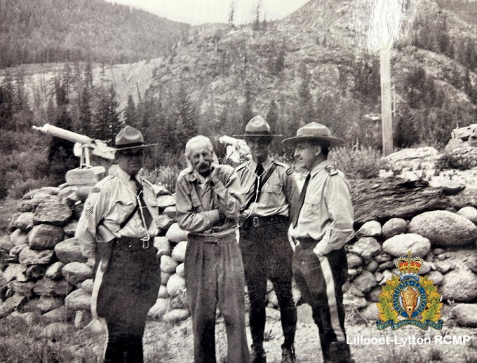 A historical picture from the Bralorne Pioneer Museum archives of 3 RCMP members with an unknown man pictured in the Bralorne community, sometime in the mid to late 20th Century. 
