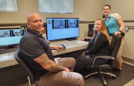 From left, Constable Phil Whiles, Dr. Heather Price, and Cst. Sam Rogers inside the interview monitoring room at the Big Bear Child Youth Advocacy Centre. 