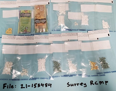 The photo of seized drugs and cash