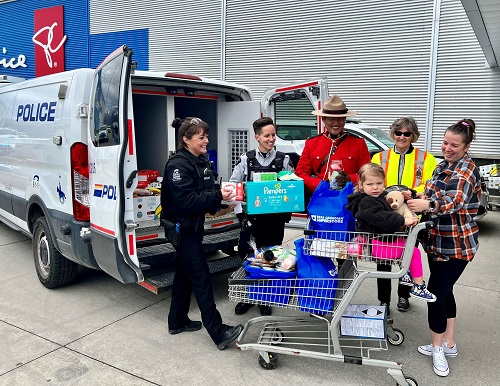 police van with police officers and donations