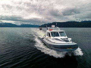 Cst. Saunders operating the Prince Rupert RCMP boat towing Jeff Easingwood's behind it.