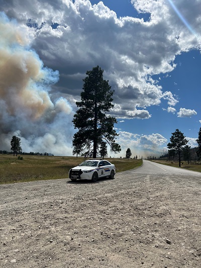 Cranbrook RCMP cruiser overlooking wildfire