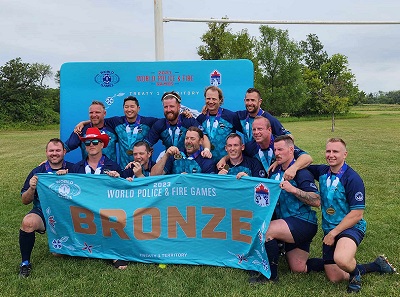 Constable Finlay with the combined Police Fire 7’s Rugby team