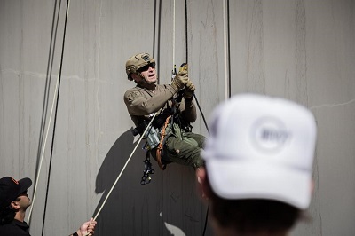 A member of the SED ERT demonstrating his rappelling skills.