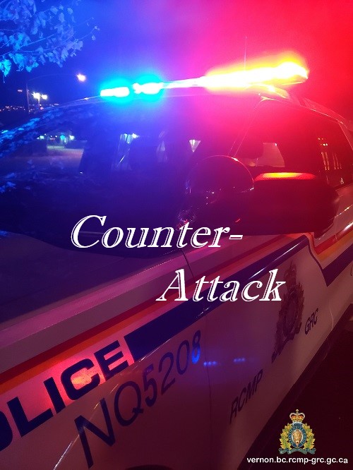 stock image of police car with red and blue flashing lights counter attack in text