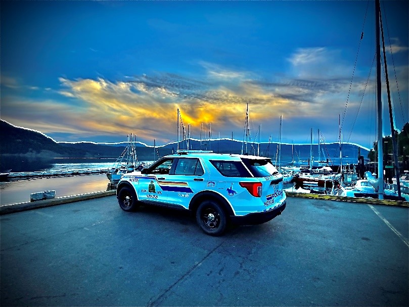 RCMP cruiser parked in front of a river